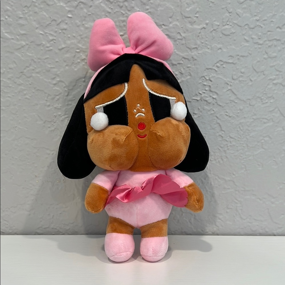 Crybaby plush with pink clothes